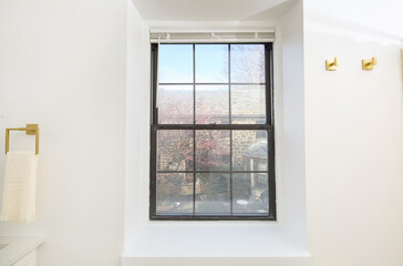 Fototapeta premium Window with view of a garden in the fall