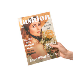 Female hand with magazine isolated on white background