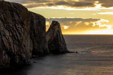 Breathtaking sunrise over Perce Rock, Gaspe Peninsula, Quebec. Captured in stunning morning light, this iconic landmark offers a serene and picturesque view.
