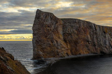 Breathtaking sunrise over Perce Rock, Gaspe Peninsula, Quebec. Captured in stunning morning light, this iconic landmark offers a serene and picturesque view.