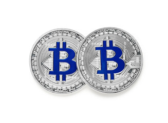 Silver bitcoins on white background, top view