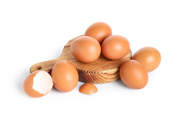 Wooden board with brown chicken eggs on white background