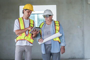 A structural engineer reviews BIM data on a tablet with a site manager. They compare digital models with physical drawings during a construction site inspection.