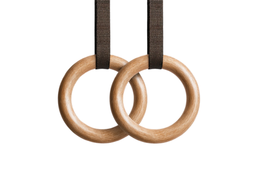 Wooden rings hang with straps on black backdrop