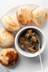 Overhead view of a plate of masa and gas meat, top view of food from northern nigeria masa and grilled meat