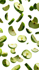 Sliced green apples floating, dark background