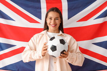 Young woman with soccer ball against UK flag
