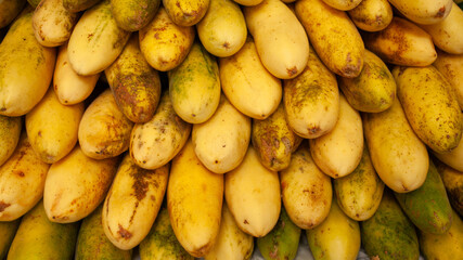 Fresh passion fruits stacked tropical fruits