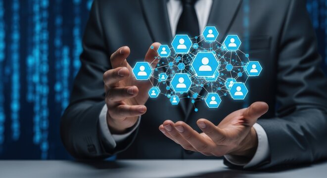 Businessman holds network of people icons connecting for social media or human resources symbolizing collaboration and teamwork