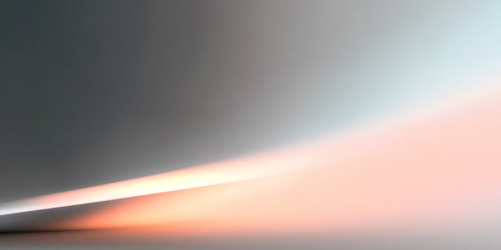 Soft gradient with peach and silver light blending across smooth minimal backdrop, abstract ad or poster background or calming modern wallpaper 