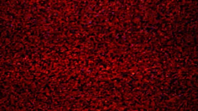 Abstract close-up of a field of red, textured elements, like tiny granules or particles