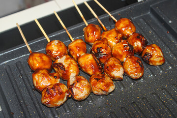 Caramelized Sweet and Spicy Indonesian Meatball Skewers