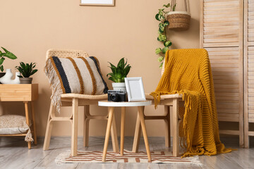 Interior of room with wooden chairs, tables and plants