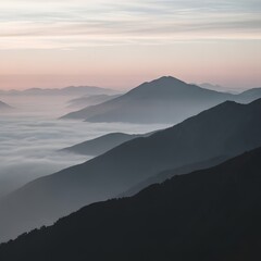 Misty mountain ridges fading into pale sunrise sky, soft pastel landscape with rolling layers and fog