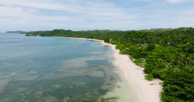 Natural scenery of tropical beach with white sand and clear waves. Santa Fe, Tablas, Romblon. Philippines.