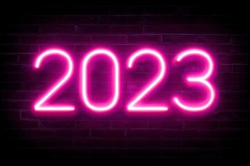 Bright Neon Sign of the Year 2023 Against Dark Brick Background