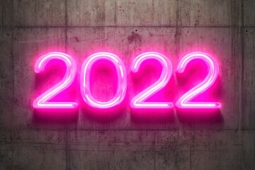 Bright Neon 2022 Sign on a Concrete Wall for Celebrations