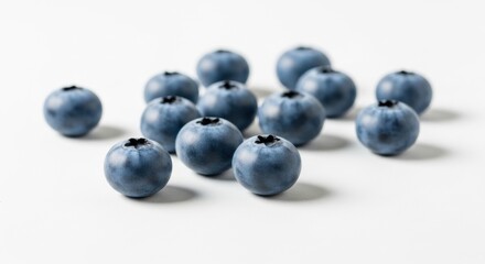 Arrangement of fresh organic blueberries isolated on white background healthy snack concept