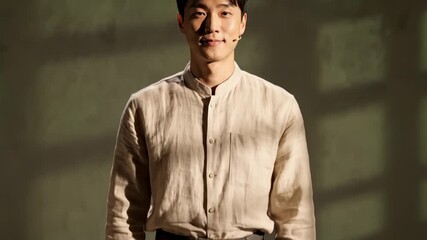 Man Bowing Respectfully Indoors, Showing Gratitude