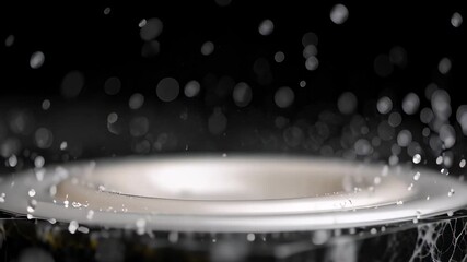 Sparkle effect of a white milk drop creating a luxurious crown splash in super slow motion on a black marble background. - Powered by Adobe