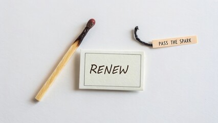Inspiring concept of renewal with matchstick and tags symbolizing growth, hope, and motivation for personal development