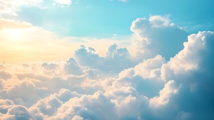 A dreamy cloudscape with fluffy clouds against a soft blue sky