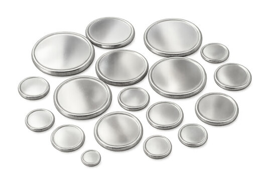 Group of small, round, silver button cell batteries used for providing power to watches, calculators, and other electronics