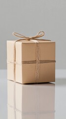 A wrapped gift box on a reflective white surface