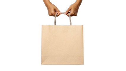 Hands holding plain brown paper shopping bag on clean backdrop isolated on white background