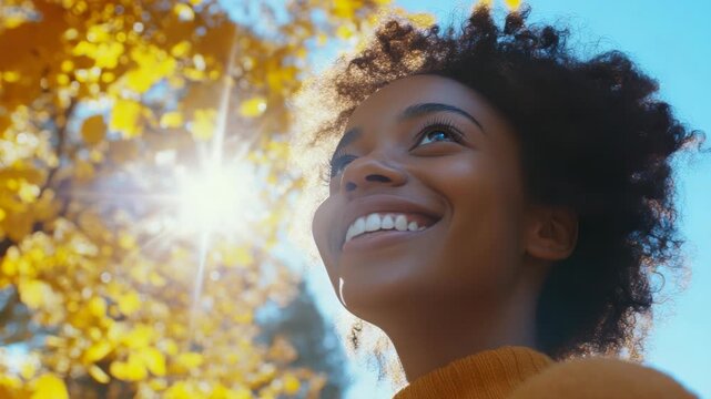 Woman looking up at sun