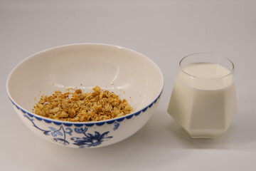 Granola Cereal bar with milk on Background Breakfast Healthy Food sweet dessert snack. Diet Nutrition Concept