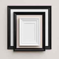 Three rectangular picture frames nested together in shades of black and white, set on a neutral background