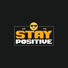Black t shirt with bold colorful text graphic that says stay positive and a skull wearing sunglasses