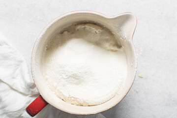 top view of plain vanilla cookie dough being mixed, process of making sugar cookies