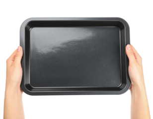 Holding a nonstick baking sheet pan for cooking and baking goods on transparent background