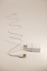 Fototapeta premium USB cable on a white background. A white prod for the phone