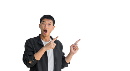 A young Asian man wearing black coat happy shocked face pointing thumbs up isolated on a white background. The person's index finger pointing to a blank space for text. Thai man.