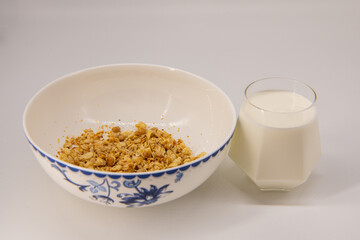 Granola Cereal bar with milk on Background Breakfast Healthy Food sweet dessert snack. Diet Nutrition Concept