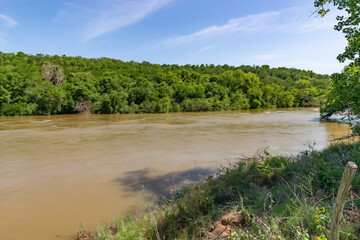 Close Riverbank View with Timbered Bluff and Water Access