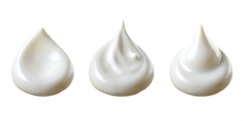 Three white cream dollops with subtle texture variations isolated on a transparent background