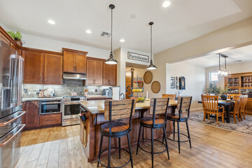 A kitchen with wood cabinets, a white stove, and granite tops