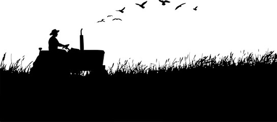 Obraz premium Tractor on a field silhouette
