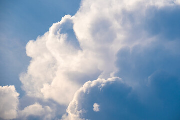 A bright, clear blue sky meets a glowing white horizon, suggesting a serene, open, and with sunlight of beautiful cloudy sky. landscape or abstract background.	