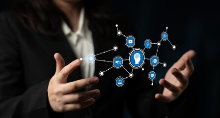 A business professional showcasing innovative technology with hands extended towards interactive...