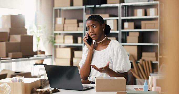 Upset, woman and phone call for logistics, startup and worried for delivery delay and communication. Unhappy, entrepreneur and black person with mobile for discussion, stock or dropshipping on laptop