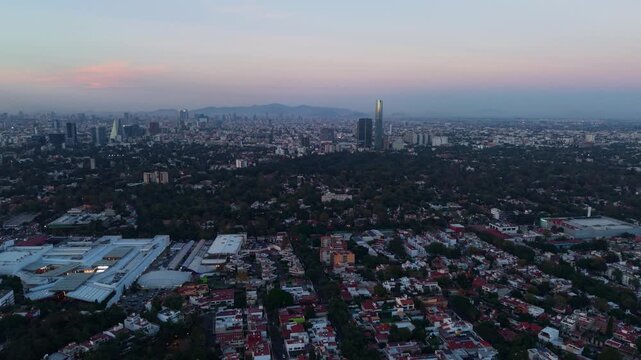 Twilight settling over southern Mexico City, aerial perspective