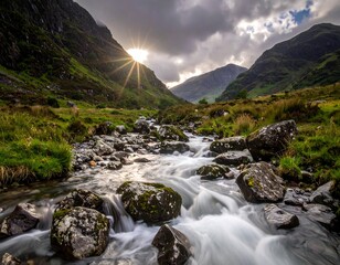 A sunlit mountain valley with a flowing river cascading over rocks, framed by lush green slopes and dramatic cloudy skies