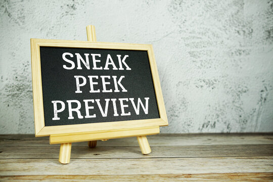 wooden easel displays a blackboard with the bold white text "Sneak Peek Preview" set against a rustic wooden surface and textured gray wall background