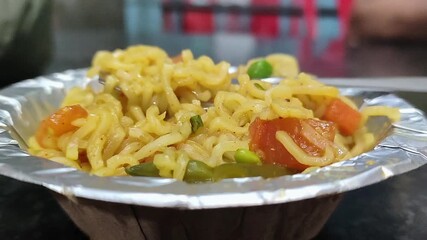 Cooked noodles in silver bowl streamy 