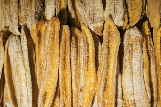 interface of human settlement, modern infrastructure, and traditional agriculture in the Northern Thailand highlands. The central concept is the stark visual contrast between the expansive, geometric